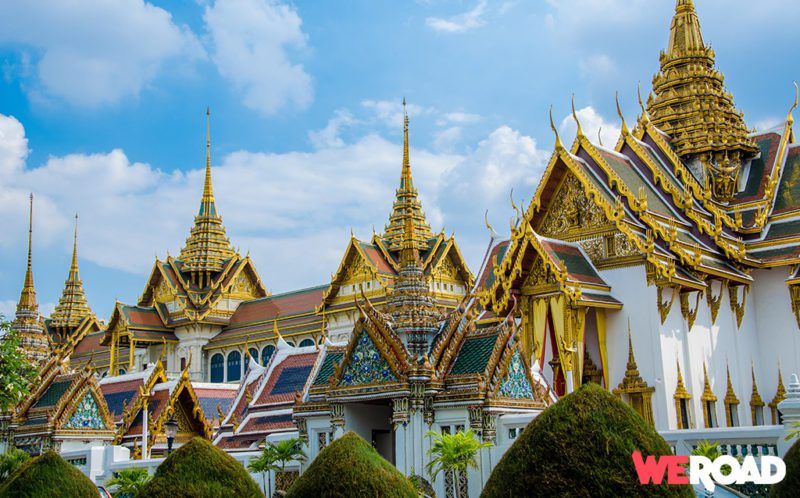 Golden roofs and white buildings in Bangkok during daytime, one of the best things to see in Thailand