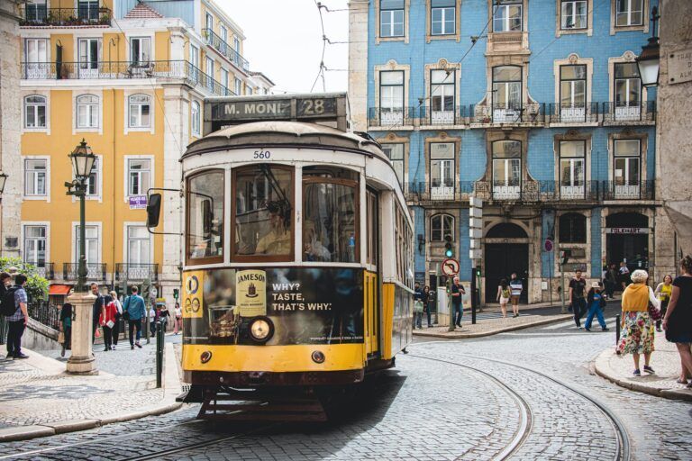 What to see in Portugal: Yellow and white tram 28 on Lisbon road.