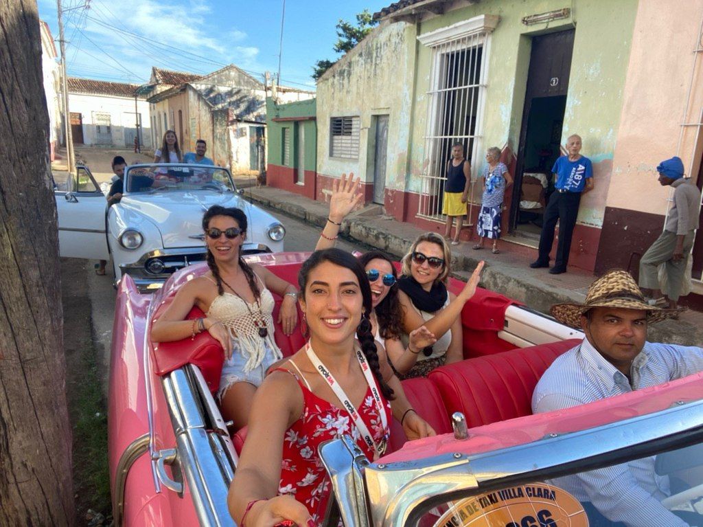 A group of girls taking a selfie in the car
