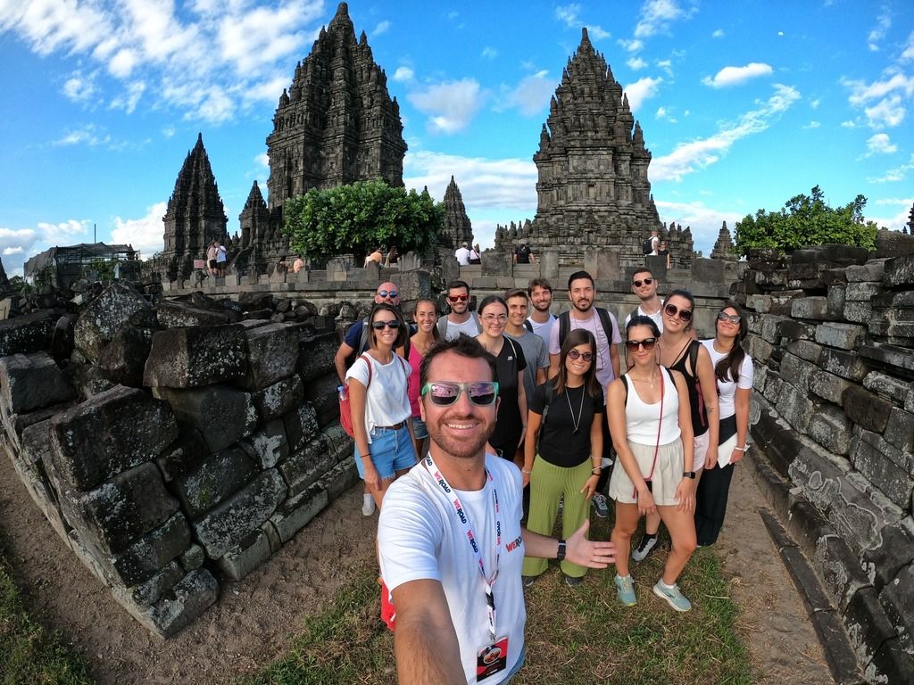 A group of WeRoaders taking a selfie in front of the Prambanan temple.