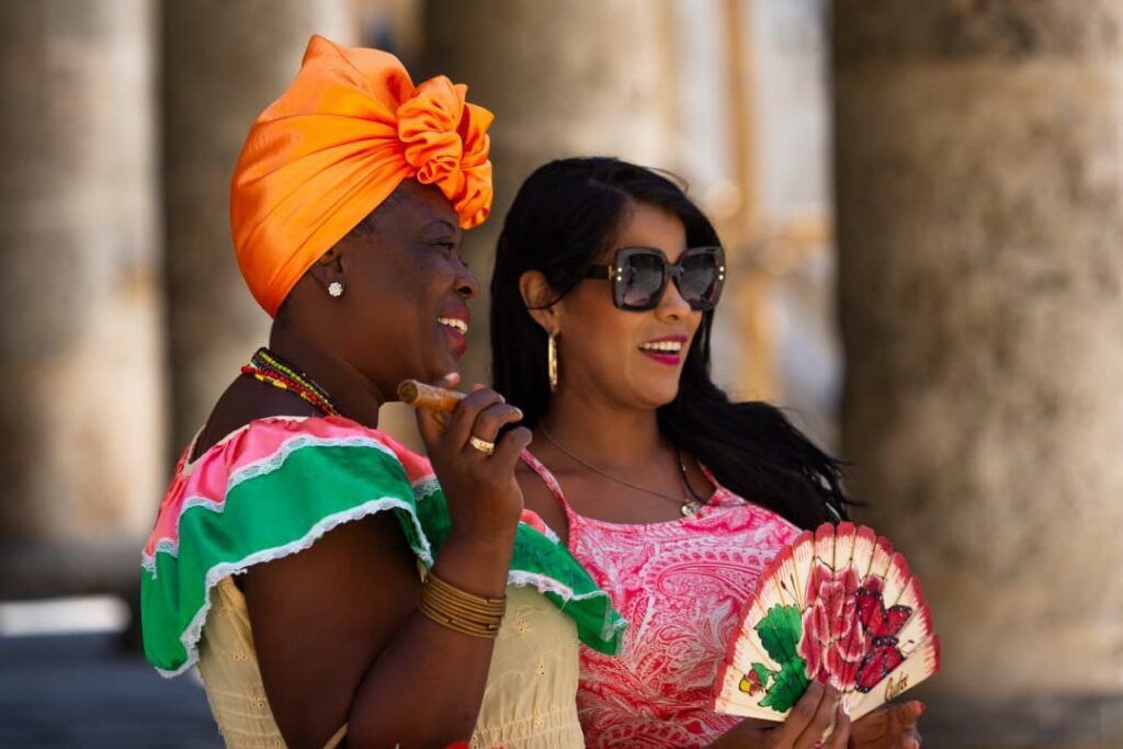 Two women wearing typical dresses in Cuba