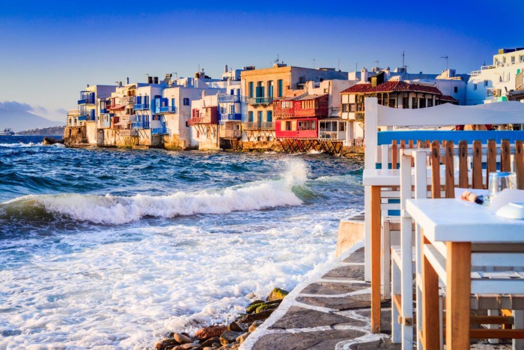waves crash on the beach of Mykonos