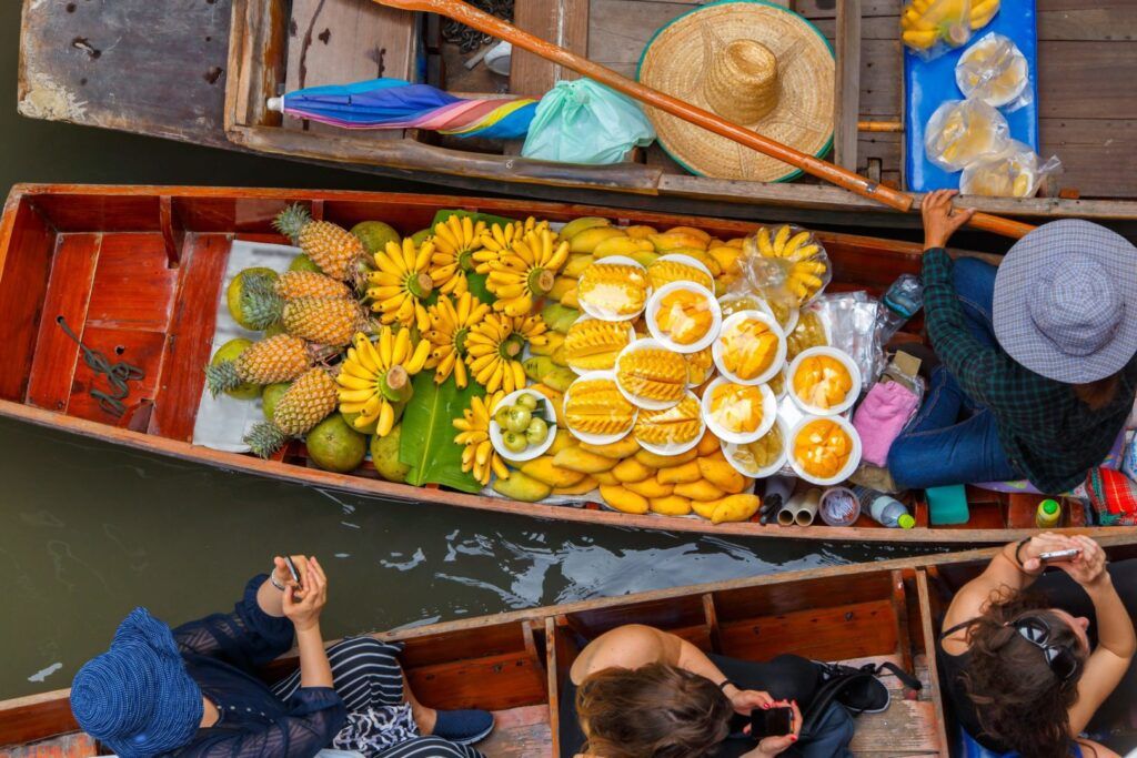 typical boats pass through the floating market