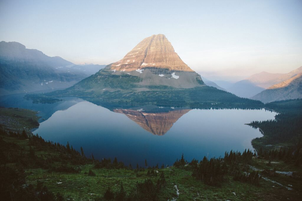 Aerial view of the lake near the mountains of Glacier National Park.