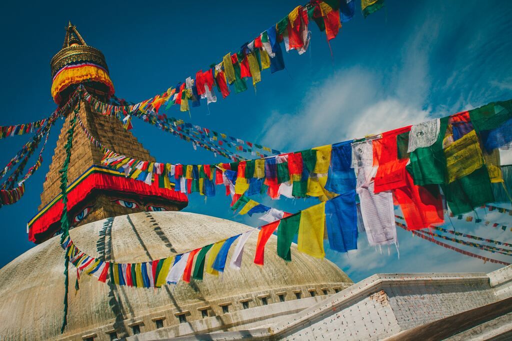 Colour-coordinated bunting on the mountains during the day in Nepal