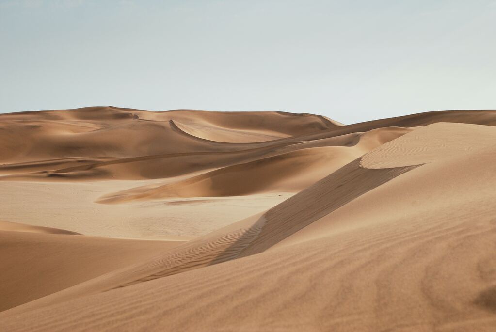 Desert under the blue sky during the day