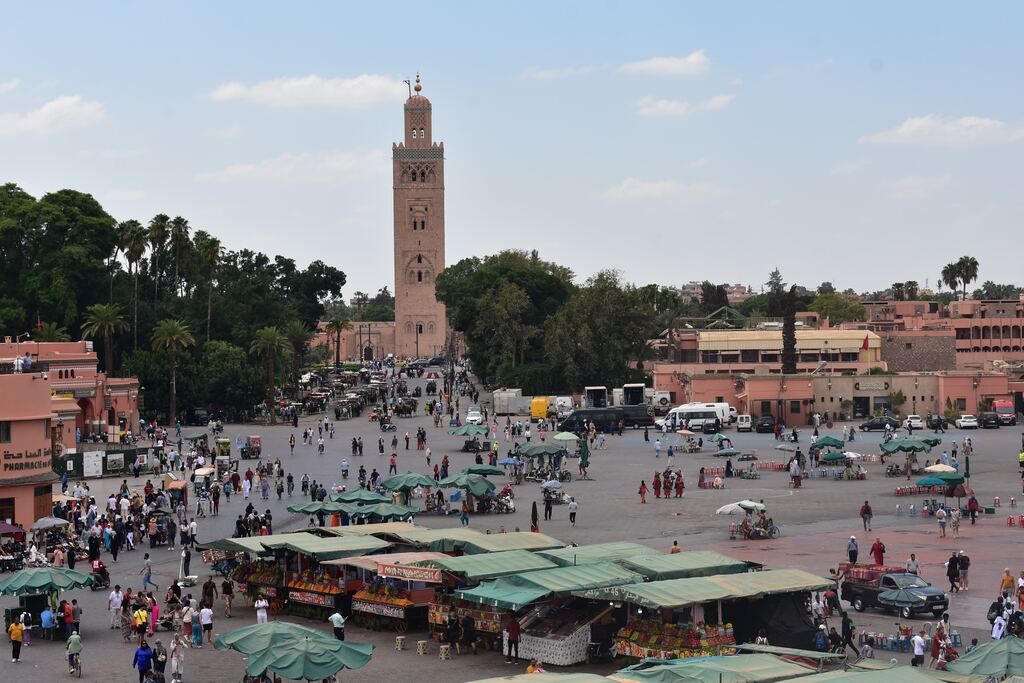 A large crowd of people in a city square.
