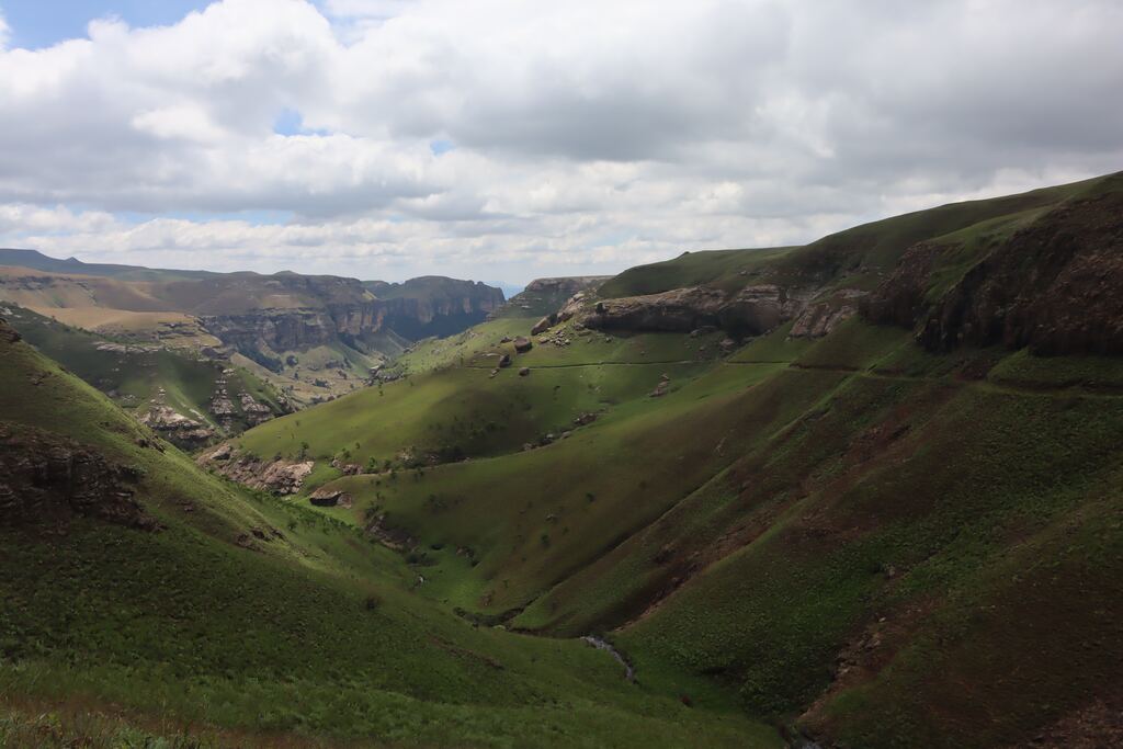A green valley with mountains in the background in South Africa