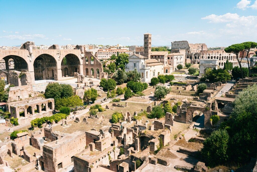 Aerial view of the Roman Forum with the Colosseum in the background