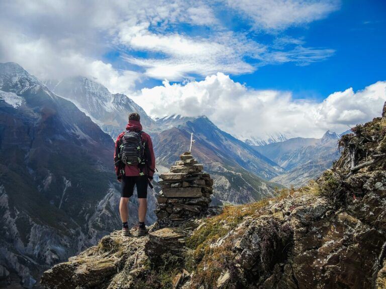 Hiker admiring the breathtaking view of the Himalayan mountains