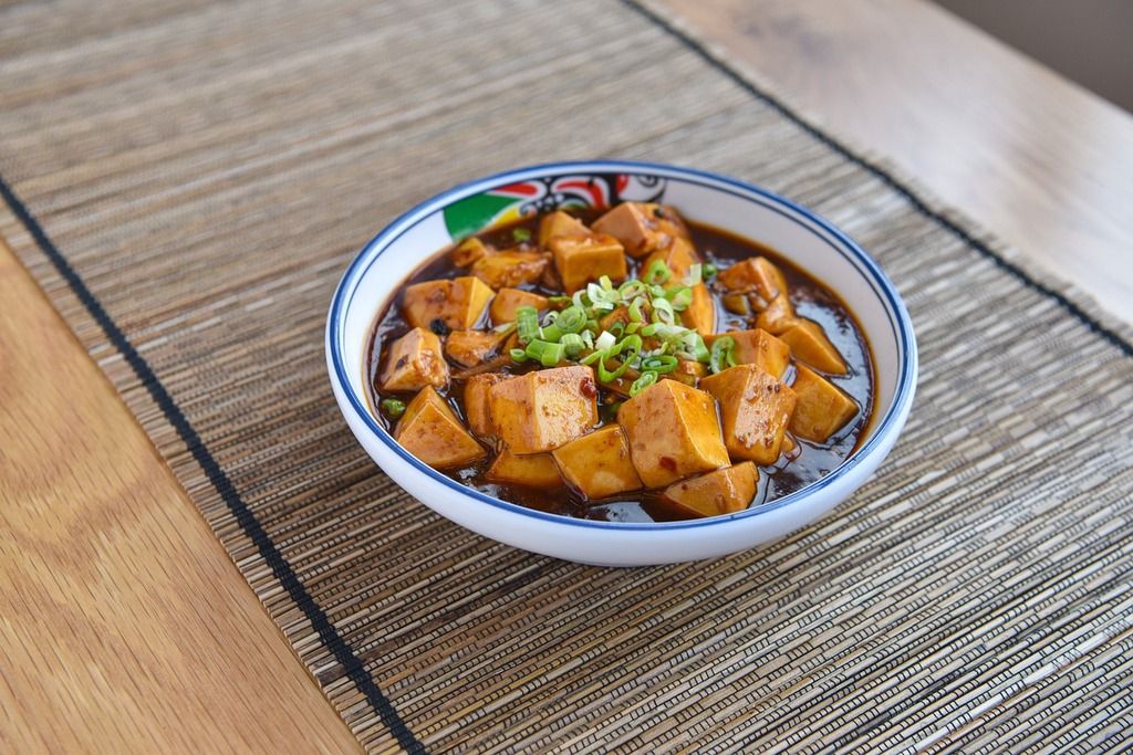 A bowl of authentic Mapo Tofu, a spicy and flavorful Sichuan dish with tofu and minced meat.
