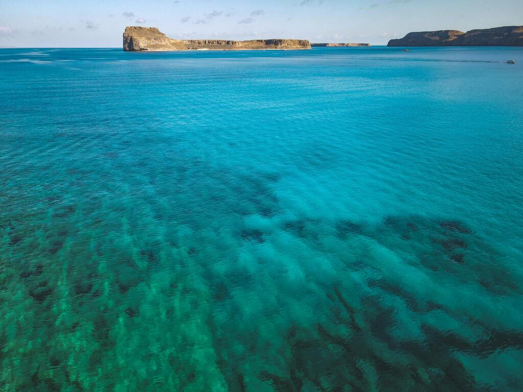 Crystal-clear sea and coastline of Gozo island, Malta