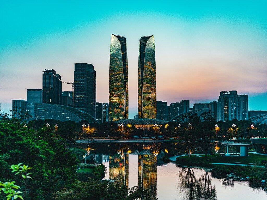 Twilight view of Chengdu skyline with Twin Towers reflected in the Jin River.