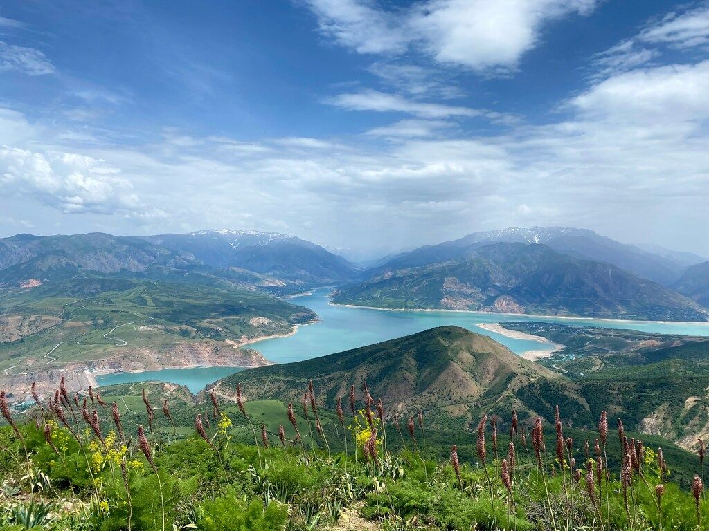Panoramic view of Charvak Reservoir surrounded by mountains, Uzbekistan