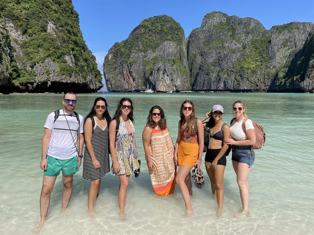 WeRoad group trip in Maya Bay, surrounded by limestone cliffs, Phi Phi Islands, Thailand