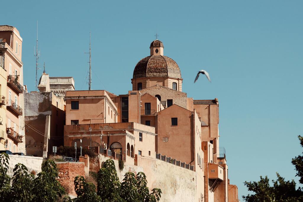 Historic view of Cagliari's old town with the dome of the Cathedral of Santa Maria in Sardinia, Italy