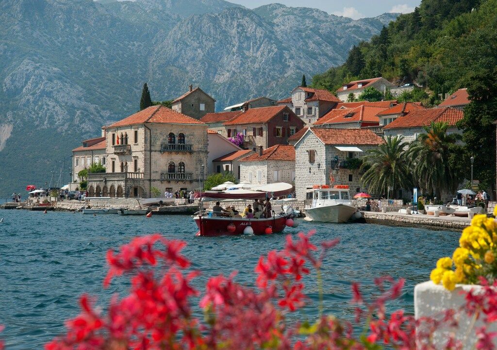 Colorful waterfront houses and boats in Perast on the Bay of Kotor, Montenegro
