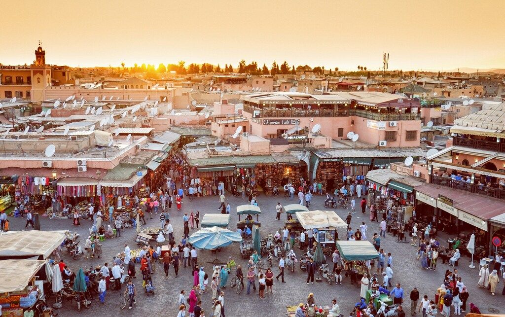 Sunset over the bustling Jemaa el-Fnaa market square in Marrakech