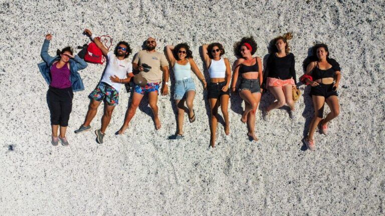 young adults on a beach - Singles holidays 25–35