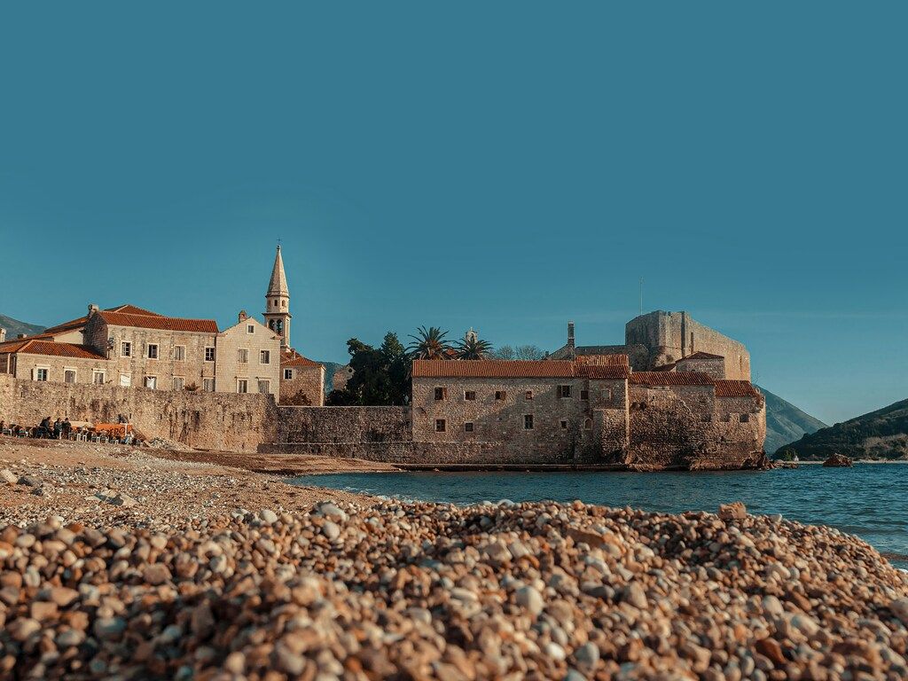 Budva old town and beach with medieval fortress on the Adriatic coast, Montenegro