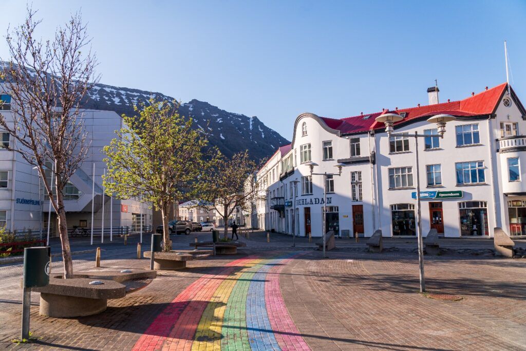 Town square in Ísafjörður, Westfjords capital, with a rainbow painted street.
