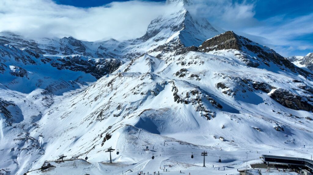 Majestic Matterhorn mountain peak towering over the snowy ski slopes.