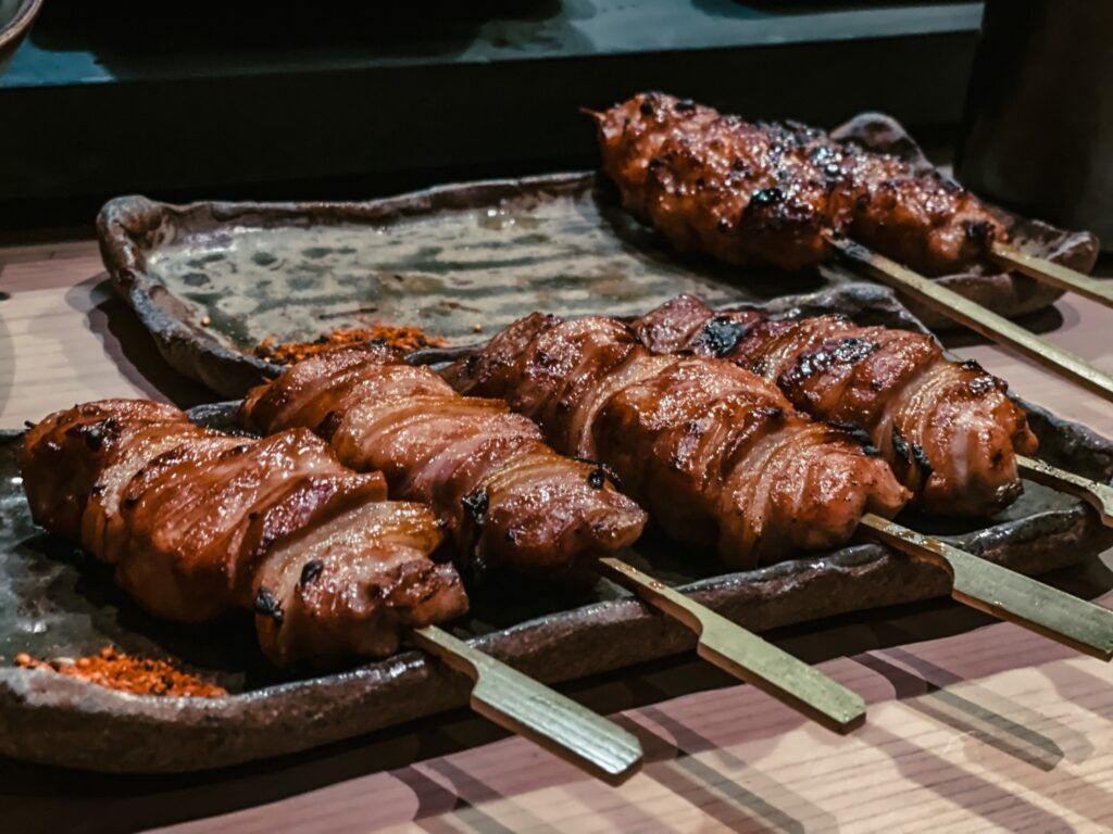 Savory Yakitori skewers grilled with tare sauce and sprinkled with spices.
