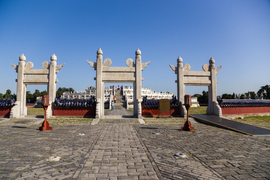 Triple white marble archway leading to the Circular Mound Altar.