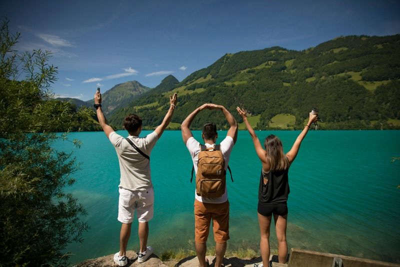Friends by a mountain lake
