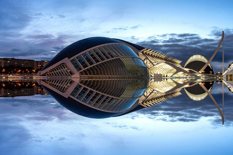 Valencia's City of Arts and Sciences with a perfect symmetrical reflection on the water during blue hour