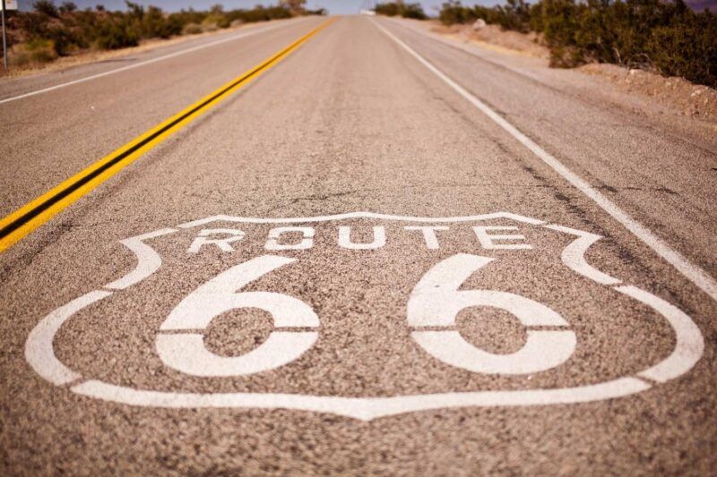 Route 66 shield painted on a desert highway Route 66 shield painted on a desert highway