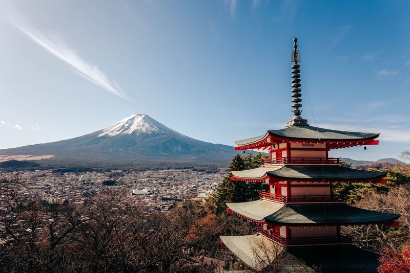 Chureito Pagoda framed by autumn foliage with snow-capped Mount Fuji rising in the background, Fujiyoshida, Japan