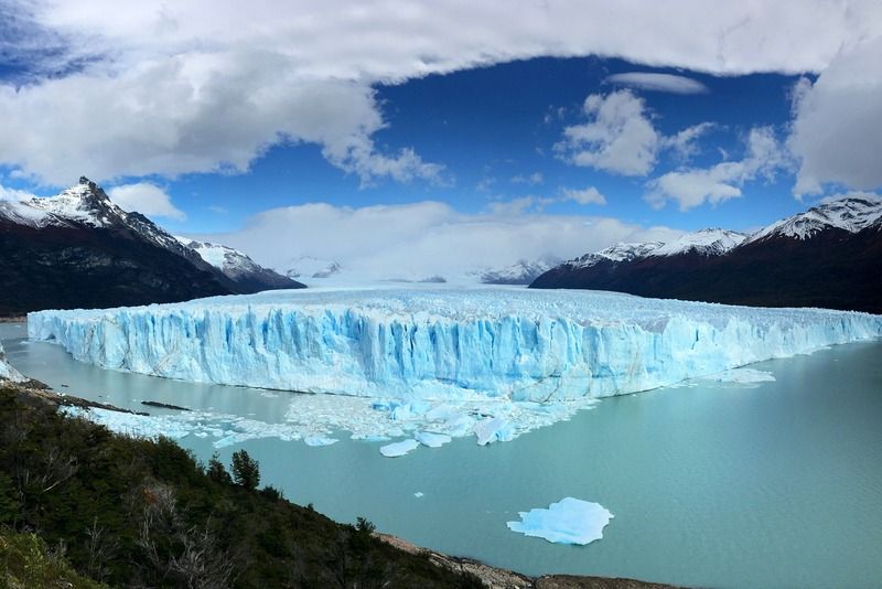 Panoramic view of the Perito Moreno glacier rising above turquoise glacial waters in Patagonia, Argentina