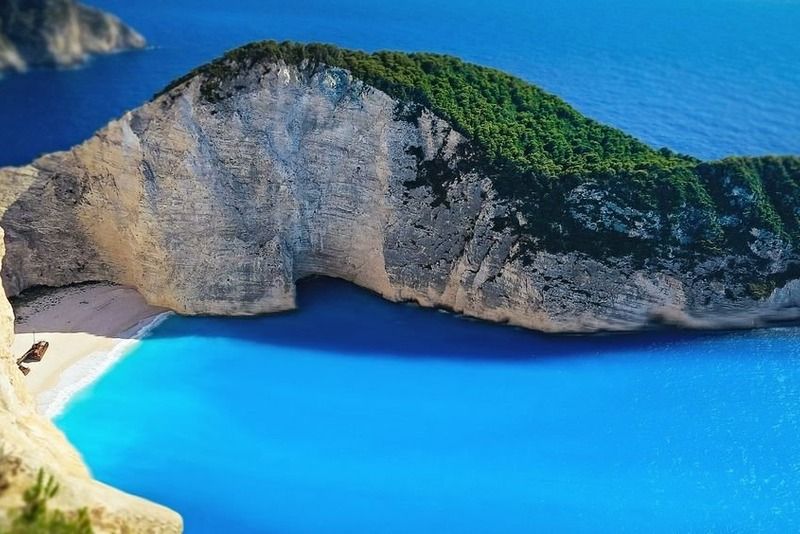 Aerial view of Navagio shipwreck beach surrounded by limestone cliffs in Zakynthos, Greece
