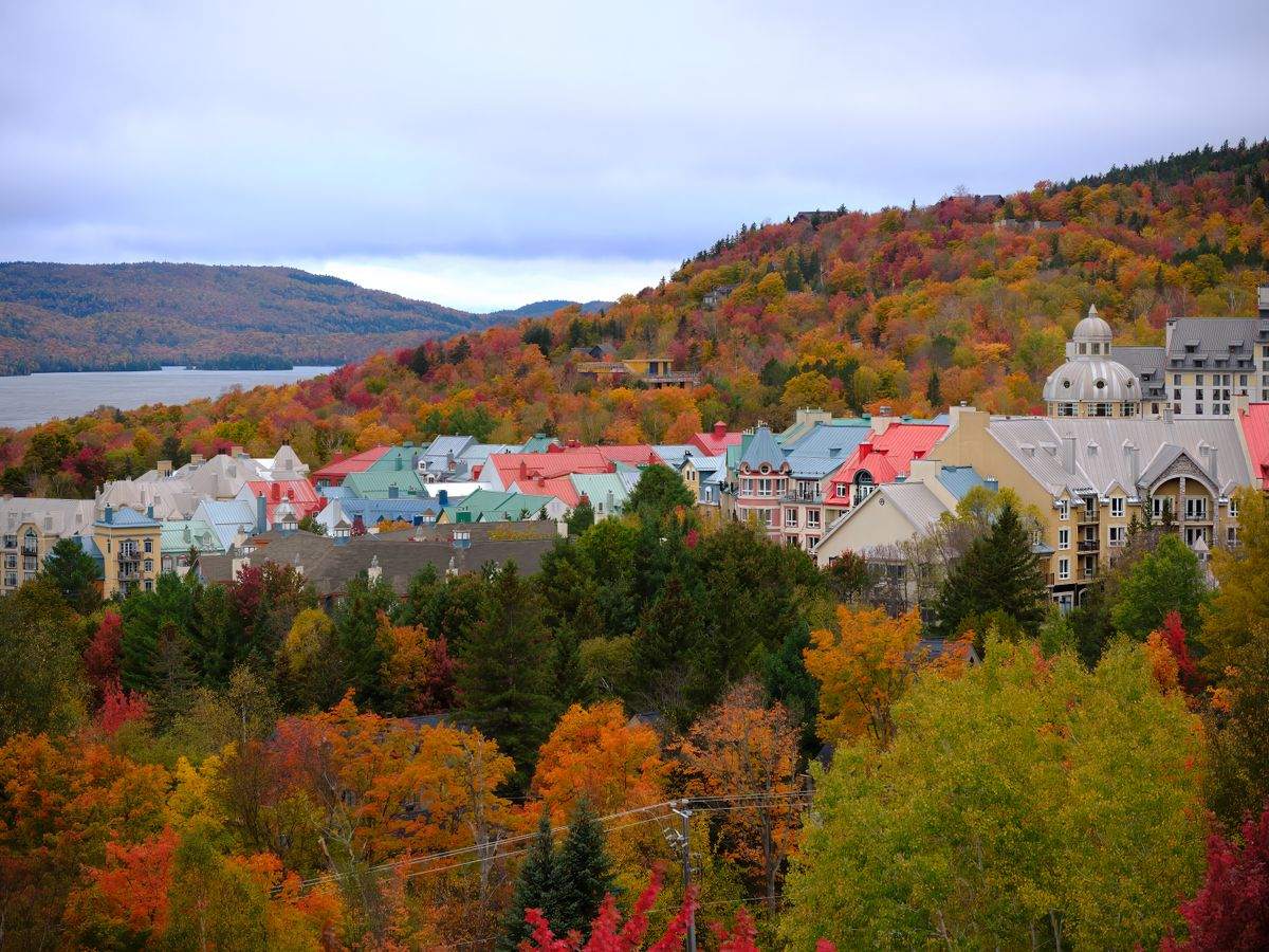 Mont Tremblant village with colorful rooftops and autumn trees on the hillside
