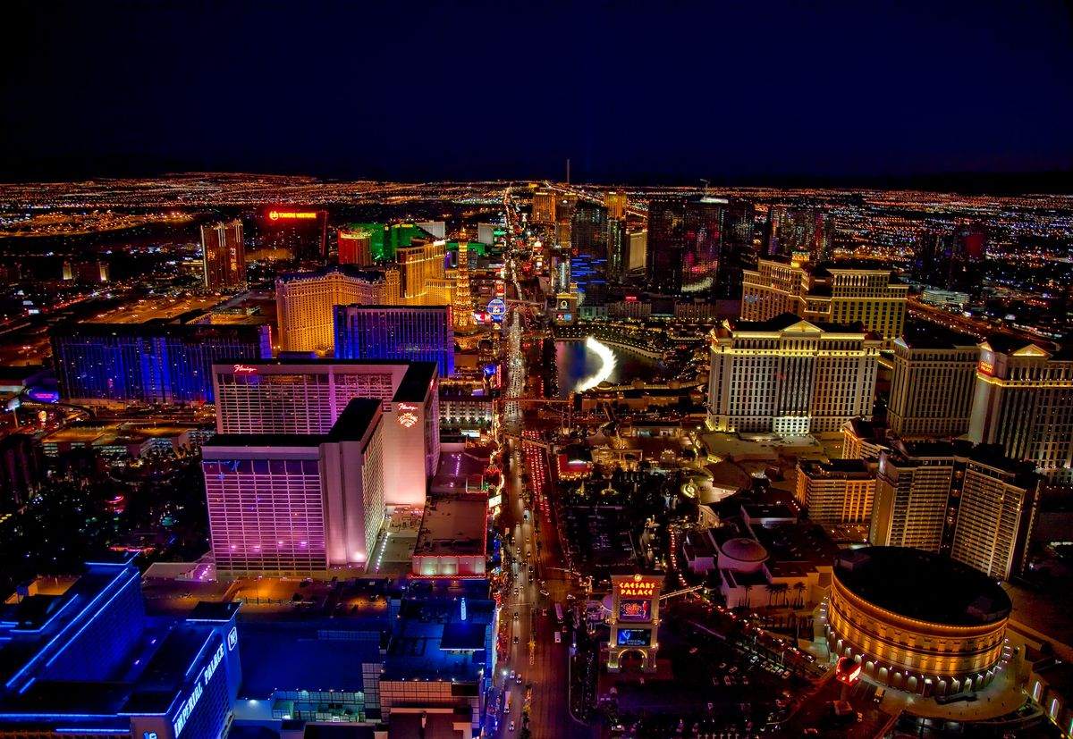 Aerial night view of the Las Vegas Strip with illuminated hotels and traffic